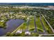 Expansive aerial view showing the community, waterfront, and available land plots at 6679 Wander Ln, New Port Richey, FL 34652