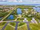 Aerial view showcases waterfront lots, existing homes, and surrounding natural beauty at 6679 Wander Ln, New Port Richey, FL 34652