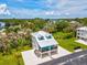 Stunning aerial view of a coastal home showcasing its premium location near the water and lush greenery at 6679 Wander Ln, New Port Richey, FL 34652