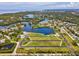 Wide aerial view showing waterfront access and available land plots; build your dream home here at 6679 Wander Ln, New Port Richey, FL 34652