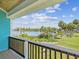 Scenic view of water from an outdoor balcony with wood ceilings and black railings at 6679 Wander Ln, New Port Richey, FL 34652