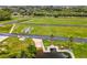 An aerial view of green home lots on a parcel of land near a river and new construction at 6707 Wander Ln, New Port Richey, FL 34654