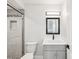 Updated bathroom with a shower stall, modern vanity, and decorative mirror at 6707 Wander Ln, New Port Richey, FL 34654