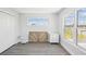 Light bedroom with luxury vinyl flooring and large windows at 6707 Wander Ln, New Port Richey, FL 34654