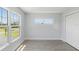 Light and bright bedroom with a large window, luxury vinyl flooring, and double door closet at 6707 Wander Ln, New Port Richey, FL 34654
