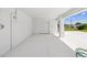 Bright, clean garage with white door, ample space, and access to the outdoors at 6707 Wander Ln, New Port Richey, FL 34654