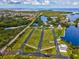 Expansive aerial view of property featuring multiple landing strips near the water with views of neighborhood and landscape at 6715 Wander Ln, New Port Richey, FL 34654