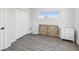 Bedroom features a closet, wood-look flooring and neutral paint at 6715 Wander Ln, New Port Richey, FL 34654