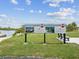 Community billboard showing the Cottages at Oyster Bayou community by Crafted Milestone, LLC, coming in 2025 at 6715 Wander Ln, New Port Richey, FL 34654