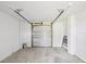 Spacious garage with a clean and functional design, perfect for parking and storage needs at 6715 Wander Ln, New Port Richey, FL 34654