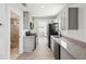 Updated kitchen features stainless appliances, stylish cabinets, granite counters and backsplash at 6715 Wander Ln, New Port Richey, FL 34654