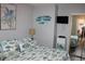 Comfortable bedroom with bright decor, a cozy bed, and ample natural light at 6800 Sunset Way # 1708, St Pete Beach, FL 33706