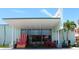 Inviting exterior view of beachfront cafe with outdoor seating and charming coastal decor at 6800 Sunset Way # 1708, St Pete Beach, FL 33706