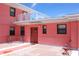 Exterior view of a charming residence with a cozy patio area and outdoor seating at 6800 Sunset Way # 1708, St Pete Beach, FL 33706