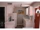 Functional kitchen featuring white cabinetry and essential appliances at 6800 Sunset Way # 1708, St Pete Beach, FL 33706