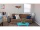 Inviting living room with a cozy couch and charming coastal decor at 6800 Sunset Way # 1708, St Pete Beach, FL 33706
