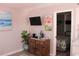 Living room with a coastal style, with TV and door leading to the bedroom at 6800 Sunset Way # 1708, St Pete Beach, FL 33706