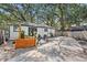 Large backyard with a patio, grill, and privacy fence, ideal for relaxing and entertaining guests at 6806 N 17Th St, Tampa, FL 33610