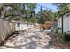 Spacious backyard with a patio, outdoor grill, privacy fence, and ample parking offering convenience and outdoor space at 6806 N 17Th St, Tampa, FL 33610