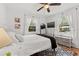 Serene bedroom with white linens, soft curtains, and stylish decor at 6806 N 17Th St, Tampa, FL 33610