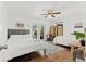 Spacious bedroom featuring two beds, hardwood floors, and access to a patio at 6806 N 17Th St, Tampa, FL 33610