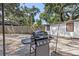Outdoor grilling station in a spacious backyard, offering a perfect setup for barbecues and outdoor cooking at 6806 N 17Th St, Tampa, FL 33610