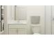 Bright bathroom with marble countertop vanity, toilet and shower at 6830 E 115Th St, Palmetto, FL 34221