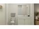 Well-lit bathroom with a marble countertop vanity and modern fixtures at 6830 E 115Th St, Palmetto, FL 34221