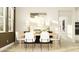 Bright dining room featuring six chairs, light wood floors, decorative lamps and an artful centerpiece at 6830 E 115Th St, Palmetto, FL 34221