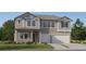 Charming two-story home with well-manicured lawn and a two-car garage at 6830 E 115Th St, Palmetto, FL 34221