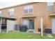 This backyard features a well-maintained lawn, patio area with sliding glass doors, and a convenient grilling space at 6925 Marble Fawn Pl, Riverview, FL 33578