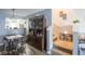 This dining room has a hutch and a table with four chairs leading to the kitchen and the stairs at 6925 Marble Fawn Pl, Riverview, FL 33578