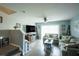 Cozy living room with fireplace, large TV, and lots of natural light at 6925 Marble Fawn Pl, Riverview, FL 33578