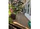 Spacious wooden deck with lush plants and garden views provides a relaxing outdoor space at 715 Riverside Dr, Tarpon Springs, FL 34689