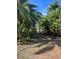 Charming home with palm trees offers a tropical lifestyle with a quiet atmosphere at 715 Riverside Dr, Tarpon Springs, FL 34689