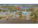 Waterfront home features multiple docks, lush landscaping, and direct access to the bay at 739 Chesapeake Dr, Tarpon Springs, FL 34689