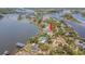 Waterfront home with a private dock, boat lift, pool, and beautiful water views at 739 Chesapeake Dr, Tarpon Springs, FL 34689