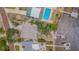 Waterfront property showcasing lush landscaping, private pool, boat dock, and neighboring homes at 739 Chesapeake Dr, Tarpon Springs, FL 34689