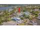 Waterfront home with dock, pool, patio and lush landscaping with mature trees in a desirable neighborhood at 739 Chesapeake Dr, Tarpon Springs, FL 34689