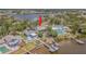 Waterfront home with dock and patio, lush landscaping and mature trees in a desirable neighborhood at 739 Chesapeake Dr, Tarpon Springs, FL 34689