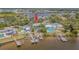Waterfront home features multiple docks and direct access to the bay, with mature trees on a well manicured lot at 739 Chesapeake Dr, Tarpon Springs, FL 34689