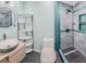Modern bathroom featuring a sleek vessel sink, contemporary tile shower, and stylish corner shelving at 739 Chesapeake Dr, Tarpon Springs, FL 34689
