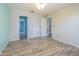 Bright bedroom with tile floors and access to hallway and adjacent rooms at 739 Chesapeake Dr, Tarpon Springs, FL 34689