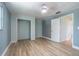 Bright bedroom showcases updated hardwood floors, closet space, and ample natural light at 739 Chesapeake Dr, Tarpon Springs, FL 34689