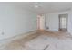 Spacious bedroom ready for customization, with an open doorway for easy access at 739 Chesapeake Dr, Tarpon Springs, FL 34689