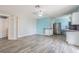 Open dining area with a modern light fixture that flows into the updated kitchen at 739 Chesapeake Dr, Tarpon Springs, FL 34689