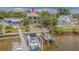 Lovely waterfront property features a private dock, boat lift and ample outdoor space at 739 Chesapeake Dr, Tarpon Springs, FL 34689