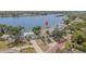 Waterfront home featuring a private dock, scenic views, and lush landscaping in a desirable neighborhood at 739 Chesapeake Dr, Tarpon Springs, FL 34689