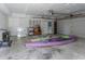 Spacious garage with ample storage, featuring kayaks, lawn mower and access to the home at 739 Chesapeake Dr, Tarpon Springs, FL 34689