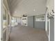 Inviting screened back porch with a ceiling fan and backyard views at 800 Embassy Rd, Largo, FL 33771